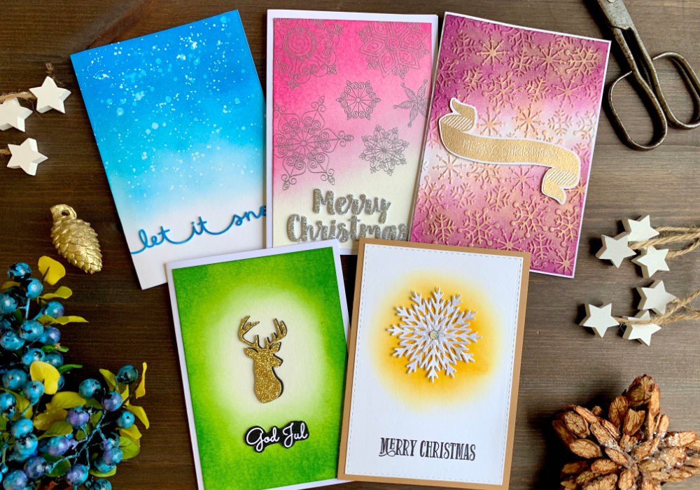 Handmade greeting Christmas greeting cards showcasing seven types of different backgrounds you can created using Distress inks or other similar inks.
