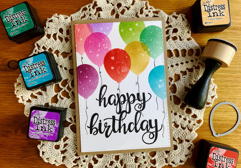 Handmade Happy Birthday card with a balloon background created with a self-made stencil and Distress inks. 