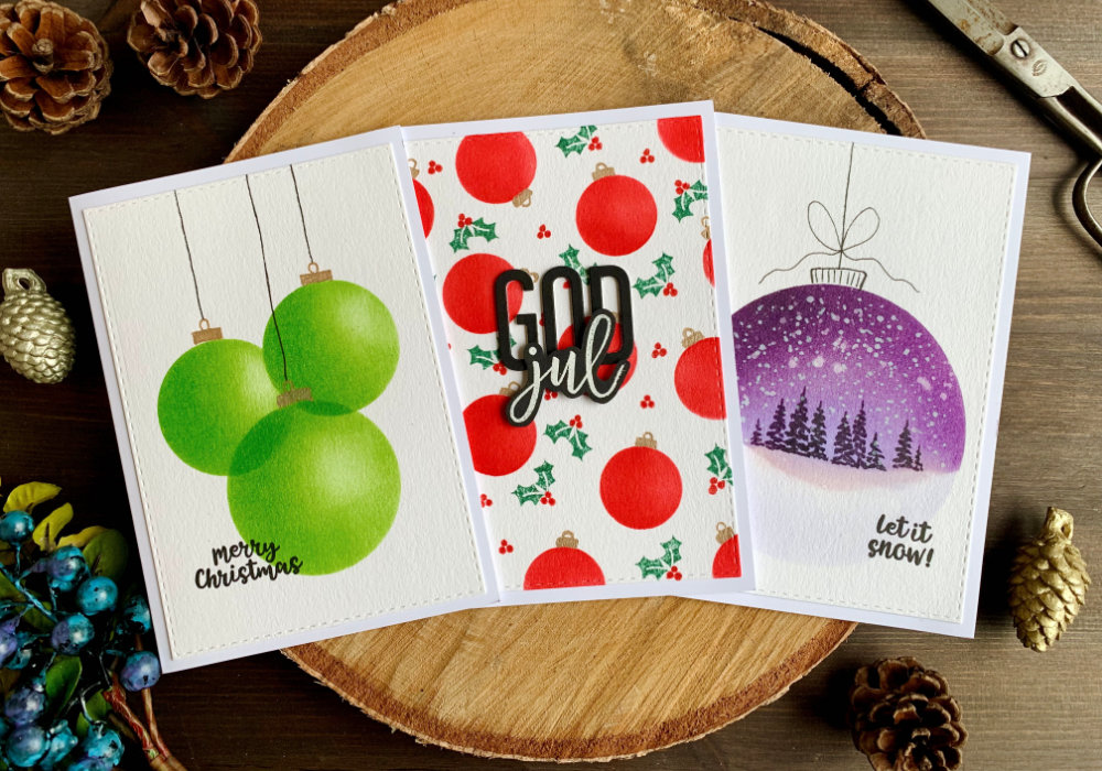 Three Christmas card ideas with baubles created with Distress inks and a (DIY) circle stencil. Make overlapping baubles, baubles background or a landscape within a bauble.