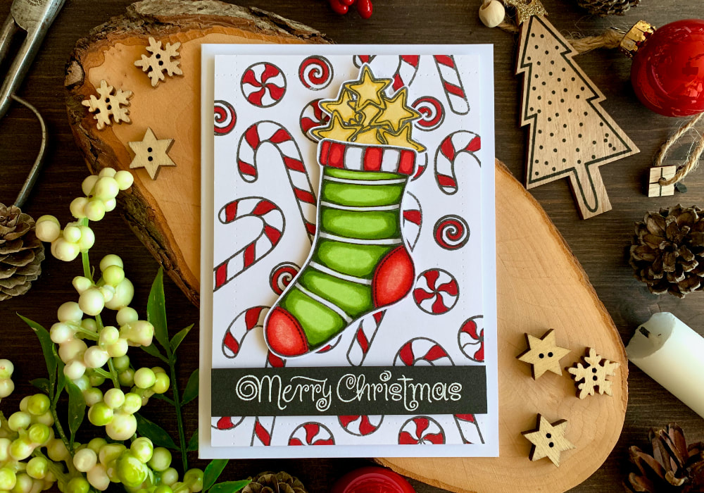 Create a handmade Christmas Holiday card using the stamp set Sweets & Treats by Create A Smile and colouring with the alcohol markers from Altenew. 