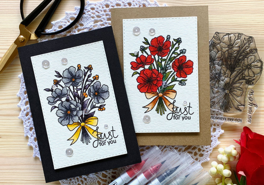 Two handmade cards with bouquet of flowers coloured with Zig Brush Markers without water. One in red one in grey.