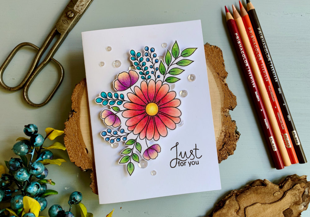 Colouring of a bouquet with a daisy flower using the Prisma colouring pencils and making a simple Birthday card. Includes a free printable.
