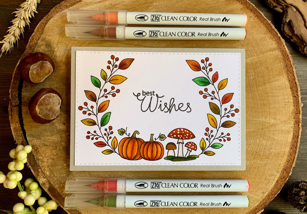 Handmade card with an autumnal wreath with pumpkins, mushrooms, leaves and berries, coloured with the Zig Clean Brush Markers using a digital stamp available for free on my blog.
