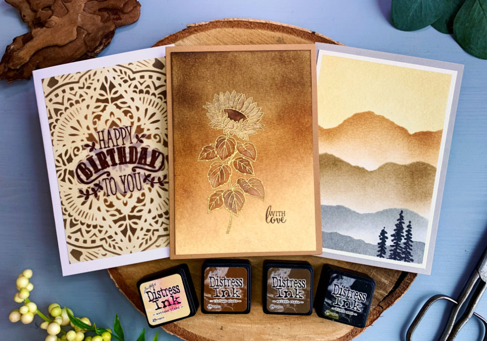 Make beautiful backgrounds for your cards using the Tim Holtz Distress Inks with these blending colour combinations from the Mini Ink pad Kit #3: Antique Linen, Vintage Photo, Walnut Stain, Black Soot.