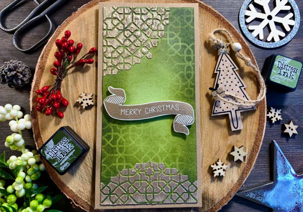 Create a very simple Christmas card using stencil together with embossing paste and embossing powder making a beautiful golden pattern on a green background created using Distress inks.