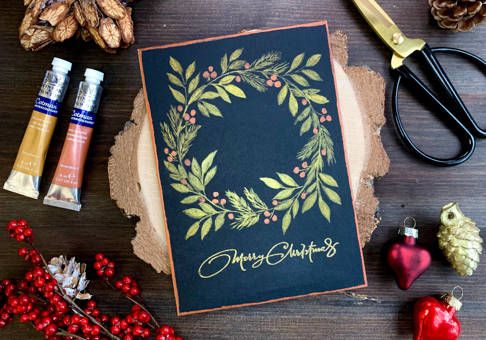 Handmade Christmas greeting card with a hand painted wreath painted with golden metallic watercolours on a black card stock. Prefect for a last minute Christmas cards.