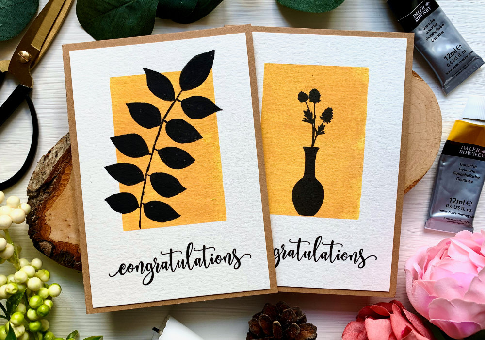 Create a quick and easy DIY card and paint an abstract minimal boho black leafs on solid background using gouache.