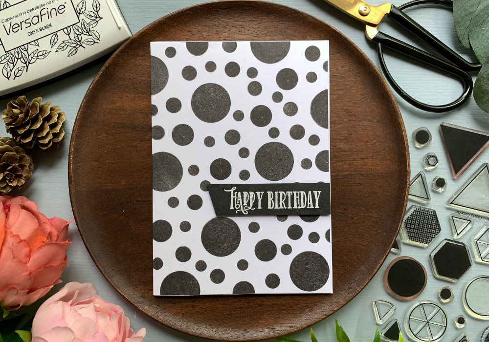 Create a very quick and simple black and white card using circle stamps and black ink.