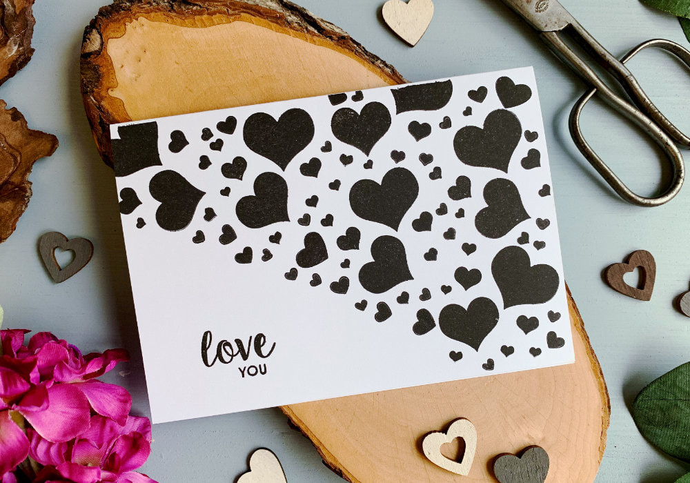 Make a very quick and simple Valentine's day card with hearts stamped with a black ink onto a white card base. Perfect for those of you who are new to card making.

