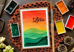 Handmade card with a watercolour red and yellow sunset and green mountains. Perfect for beginners with minimal supplies.
