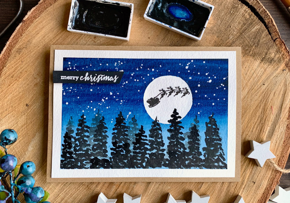 Quick and easy winter landscape Christmas card with a night sky, moon and snow and simple silhouettes of fir trees.