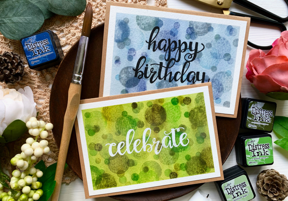 Create a handmade card with a beautiful and colourful background with circle stamps and stamping them using Distress inks and reactivating the inks with water to create a background with a soft bokeh effect. Perfect for Father's day cards or other cards for men.