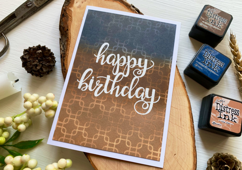 Make a very simple Happy Birthday handmade card by creating a quick and easy background with a stencil and cool Distress ink blending combination - Tea Dye, Vintage Photo and Chipped Sapphire.