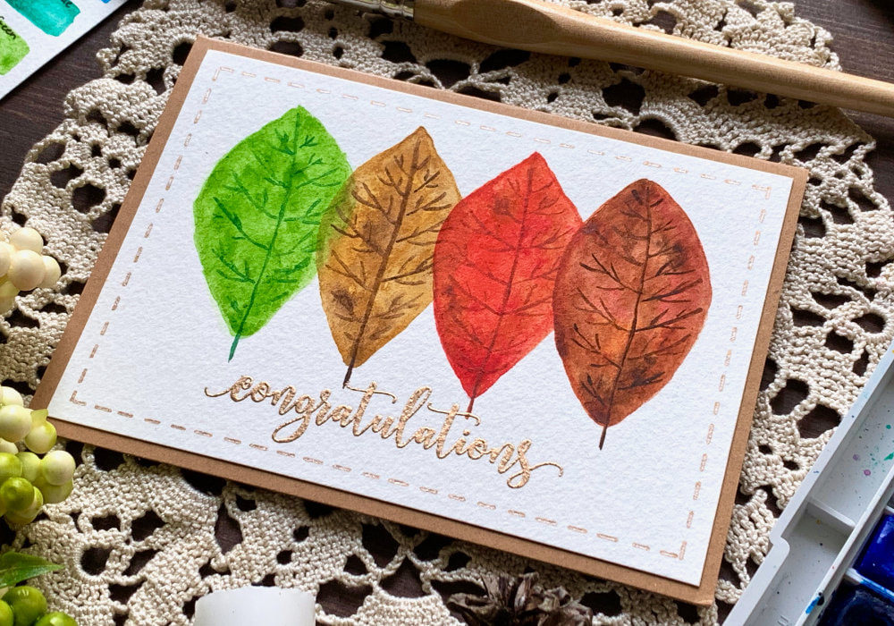 Make a simple handmade card with painted leafs in autumnal colours using watercolours. This is a very easy budged and beginner friendly card.