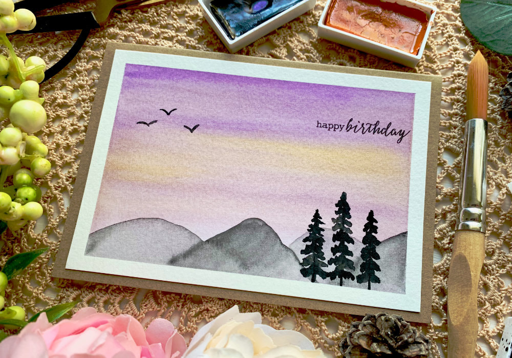 Learn how to paint a quick and easy landscape with mountains at sunset using watercolour and make a beautiful handmade card. Easy landscape sunset mountains watercolour painting for beginners.