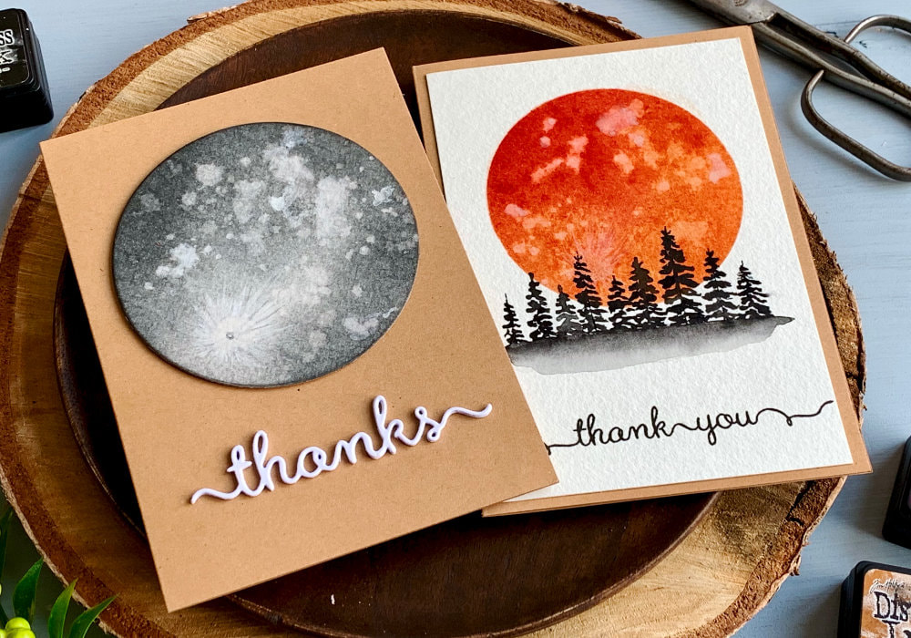 Handmade greeting card with a moon created using a very quick and simple technique by blending Distress inks, sprinkling it with droplets and lifting them with a paper towel.