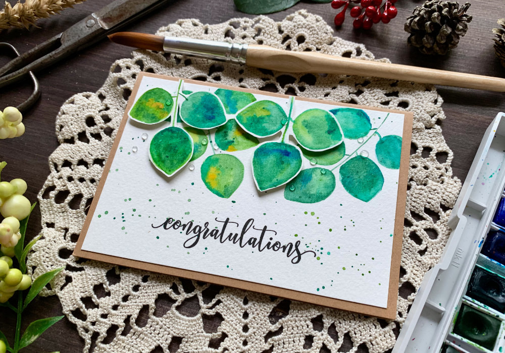 Create a beautiful handmade greeting card for the early fall by painting very simple green leaves with added dimension by fussy cutting and adding foam tape. This card is budget friendly and perfect for beginners.