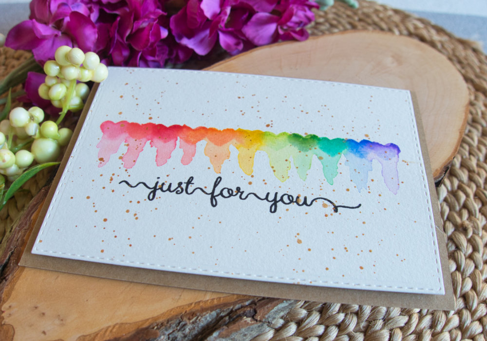 Easy rainbow heart card creating scribbly reflections using a heart stamp and distress inks.