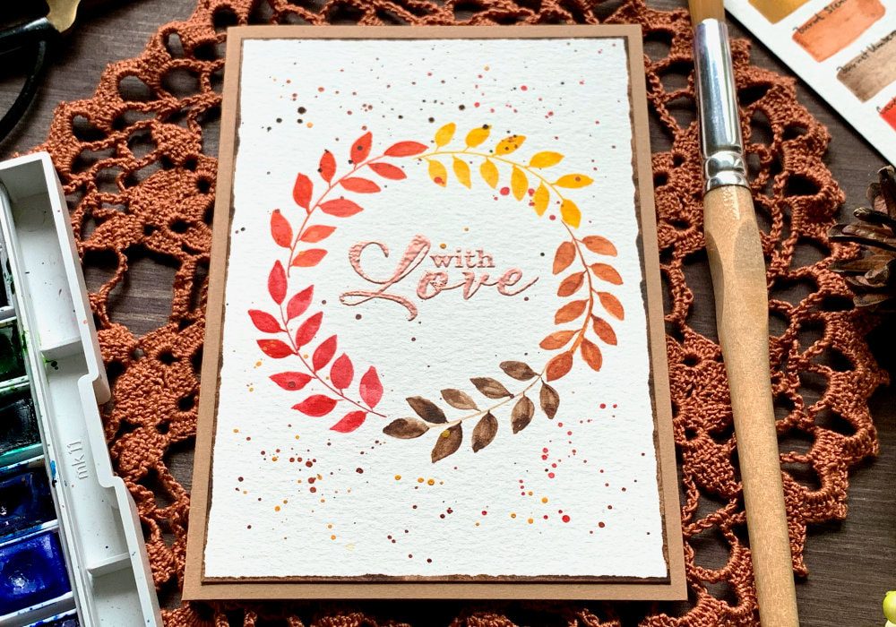 Handmade budget friendly card with a very simple watercolour wreath in autumnal colours.