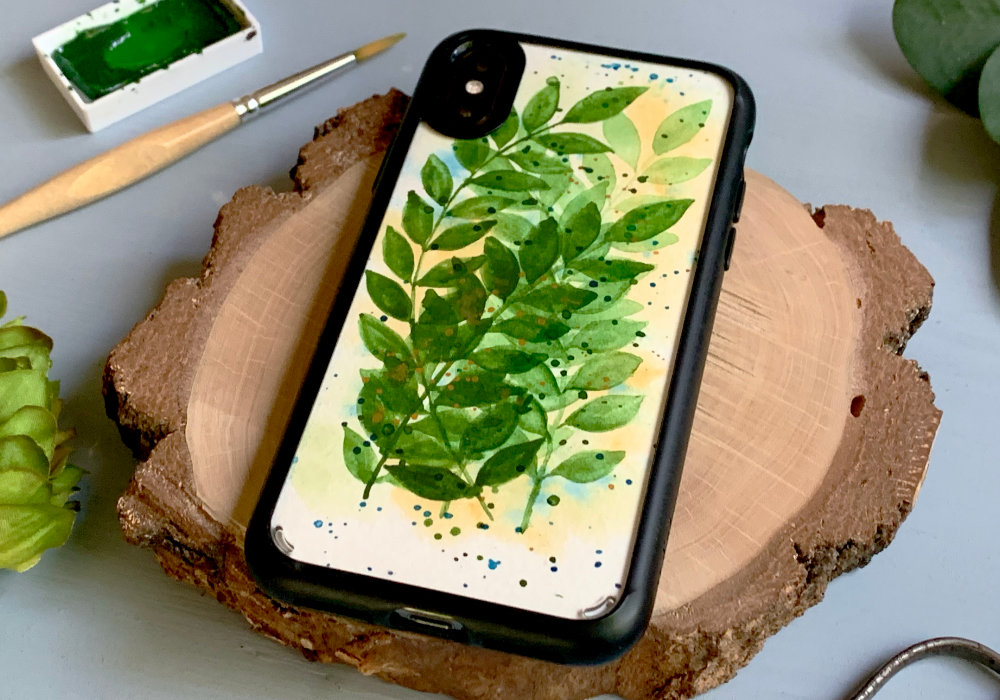 A tutorial for making a DIY insert for a clear mobile phone case. Learn to make a re-usable template and create an insert with overlapping green watercolour leaves.