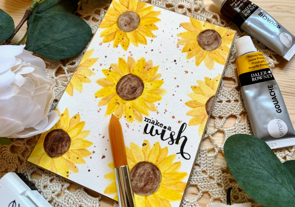 Happy Birthday card with multiple hand painted very simple sunflowers using gouache.