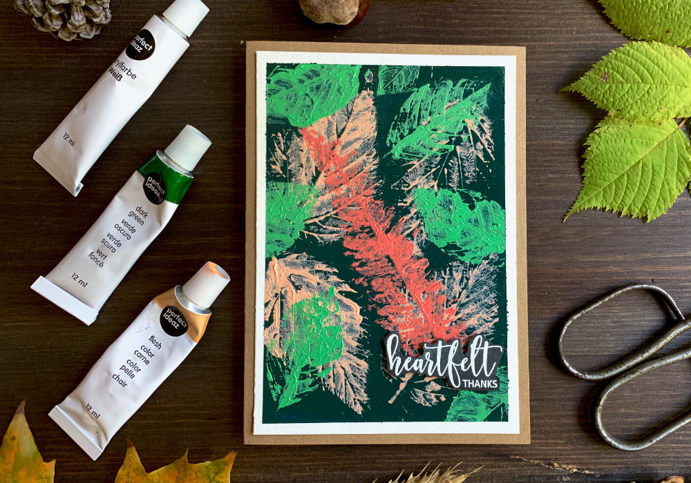 Make a simple autumnal Thank You card with stamped leaves using acrylic paints.