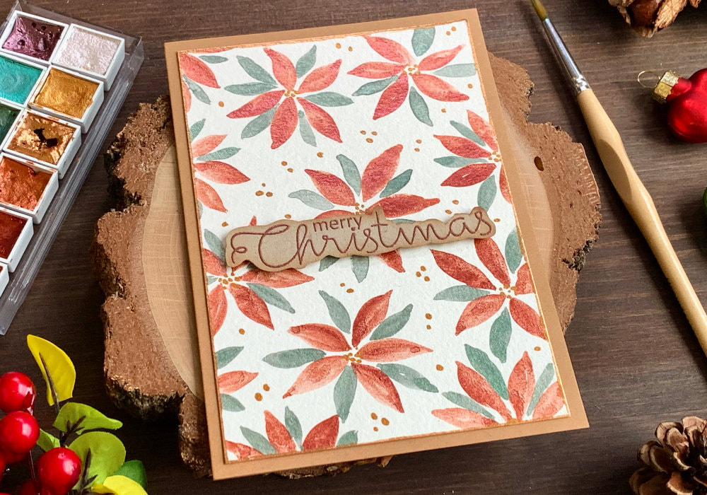 Handmade Christmas card with simple loose watercolour poinsettias painted with metallic watercolours.