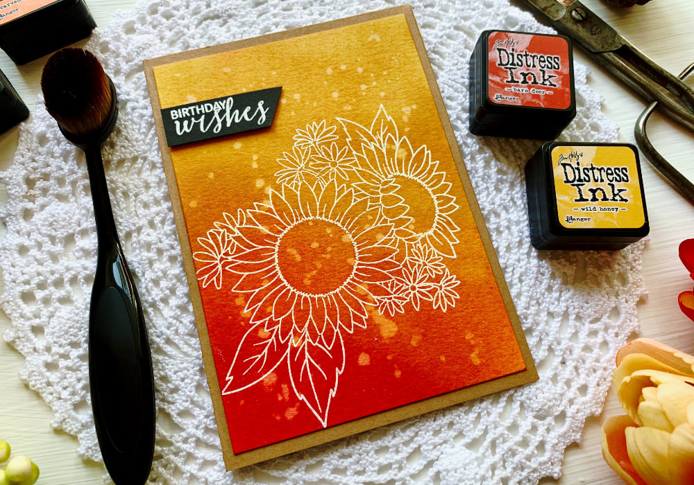 Make  a simple handmade Happy Birthday card by creating a quick Distress ink blending combination using the inks Barn Door, Curved Pumpkin, Wild Honey, Mustard Seed and Squeezed Lemonade and stamping and heat embossing a sunflower with a white embossing powder. 