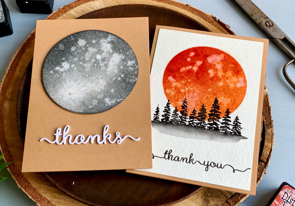 Handmade greeting card with a moon created using a very quick and simple technique by blending Distress inks, sprinkling it with droplets and lifting them with a paper towel.