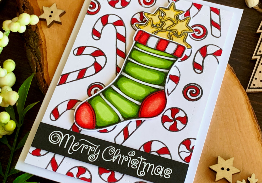 Handmade Christmas And Holiday card with a stamped and die-cut Christmas stocking filled with stars and stamped background filled with candy canes, coloured with alcohol markers from Altenew.
