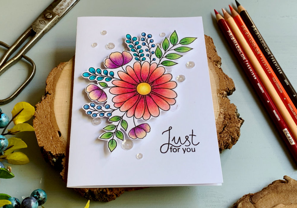 Handmade Birthday card with a Just For You greeting and a flower bouquet. The main flower in the bouquet is a big pink/orange daisy surrounded by a few smaller flowers, leaves and berries.