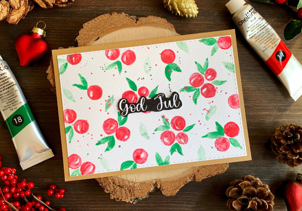 Handmade Christmas card with painted winter berry background using cheap watercolour supplies from Lidl.   