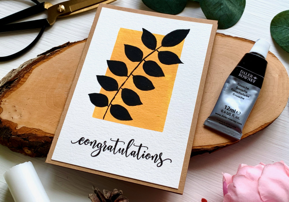 Create a quick and easy DIY card and paint an abstract minimal boho black leafs on solid yellow background using gouache.