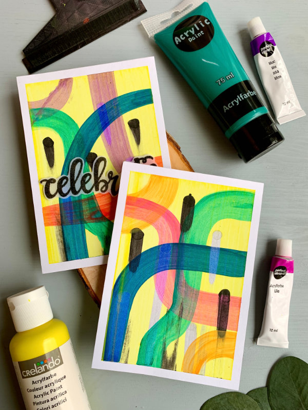 Handmade card with a background created doing the squeegee painting technique. With pink, blue and green squigely lines, few black lines and yellow background.