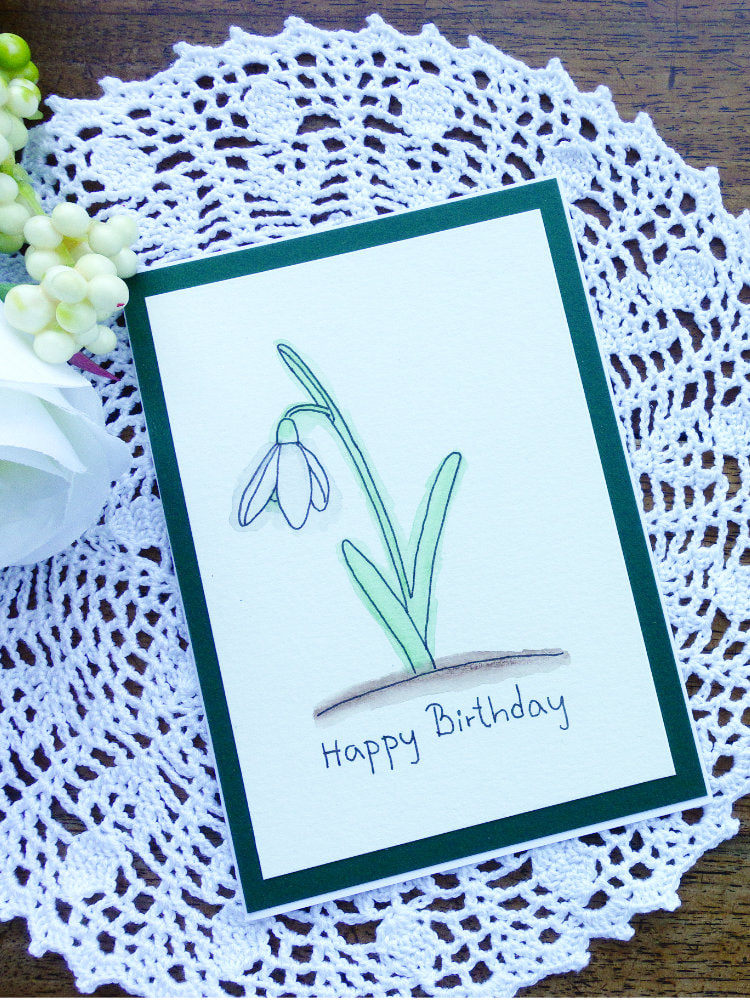 Simple spring card with the flower snowdrop, doing messy watercolouring with watercolour pencils.