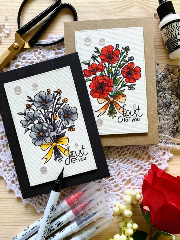 Two handmade cards with bouquet of flowers coloured with Zig Brush Markers without water. One in red one in grey.
