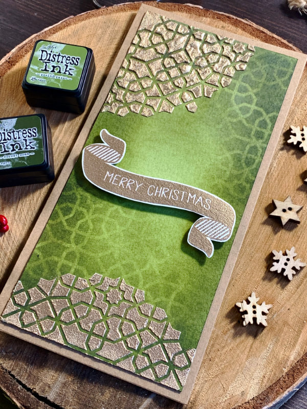 Handmade Christmas card with a green background using Distress inks with beautiful mandala made by using a stencil and creating a tone on tone blending as well as using embossing paste with embossing powder to create a golden mandala pattern.