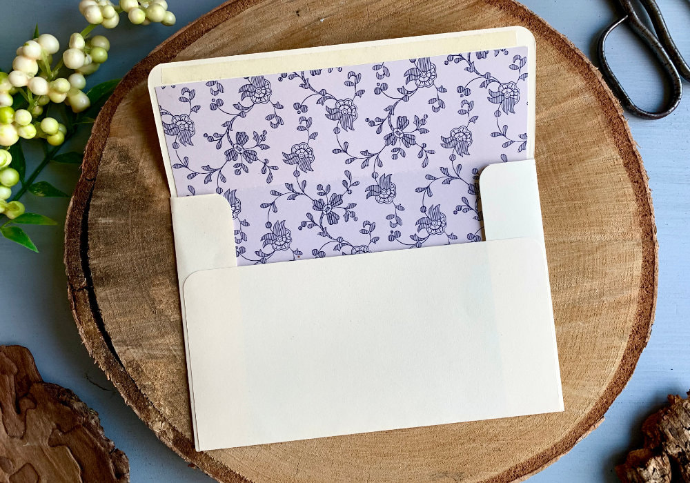 Two handmade envelopes created from scratch using basic tools and decorated with envelope liners.