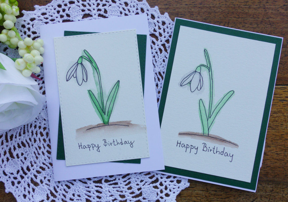 Happy Birthday card with hand drown Snowdrop flower and doing messy watercolouring with watercolour pencils.