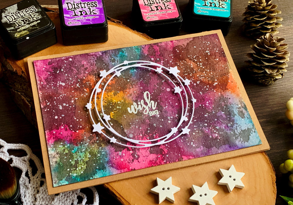 Create galaxy backgrounds using Distress Ink Black Soot.