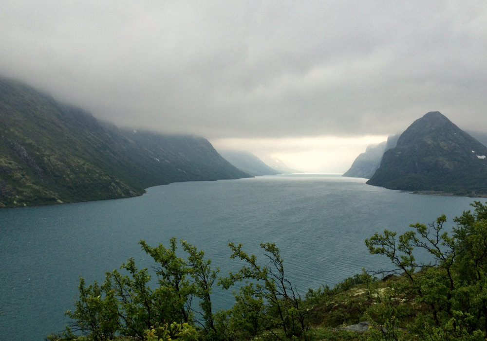 View of the lake Gjende in Norway's Jotunheimen National Park, with cloudy skies just before a storm.