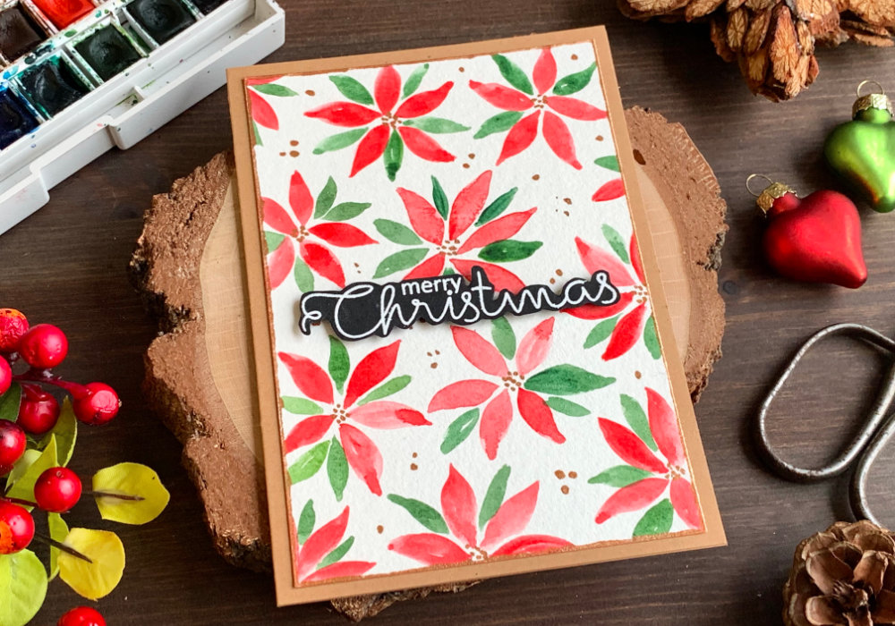 Handmade Christmas card with simple loose watercolour poinsettias.