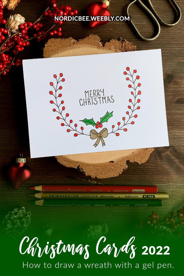 A Simple handmade Christmas card with a quick and easy hand-drawn Christmas wreath for which I used a black fine-liner and coloured with colouring pencils Includes a free printable.