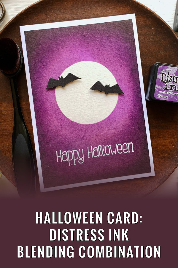 Create a very simple card for Halloween, using a mask to create a moon with bats and ink blending the background using Distress inks - Black Soot, Dusty Concord and Wilted Violet.