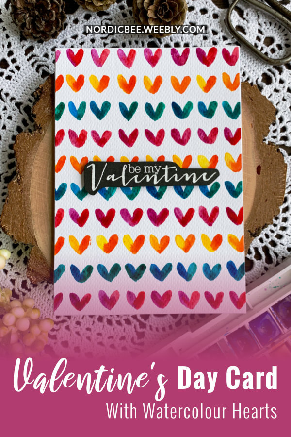 Make a very simple card for Valentine's day by painting a colourful background with hearts using watercolours.