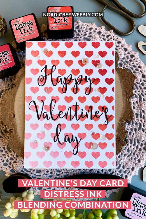 Simple handmade card for Valentine's day with a red and pink Distress ink bending combination using the inks Festive Berries, Abandoned Coral, Worn Lipstick and Spun Sugar, blended over a stencil with hearts. 