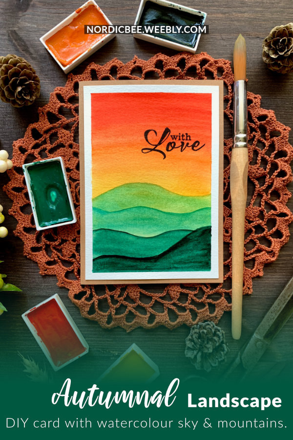 Handmade card with a watercolour red and yellow sunset and green mountains. Perfect for beginners with minimal supplies.