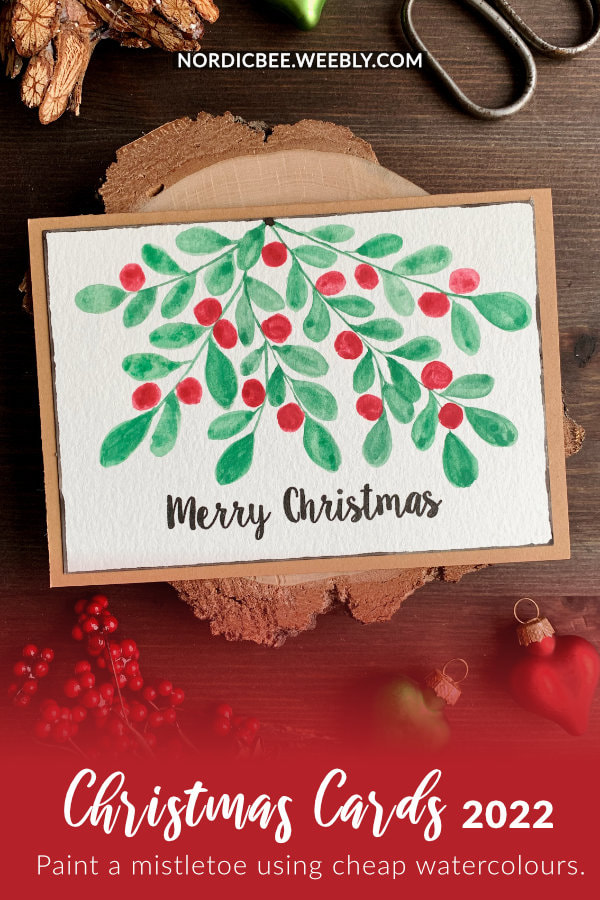 Create a simple Christmas card with a hand painted mistletoe with red berries using cheap watercolours from Lild and the Canson XL watercolour card stock.